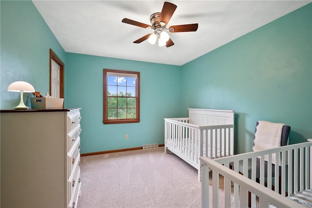 103 Cool Springs Ln, Penn Twp, PA 15636 - carpeted bedroom featuring a ceiling fan and a crib
