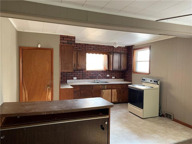 kitchen featuring light tile floors, sink, tasteful backsplash, and white electric range