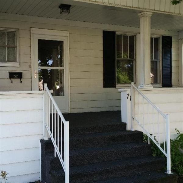 entrance to property with a porch