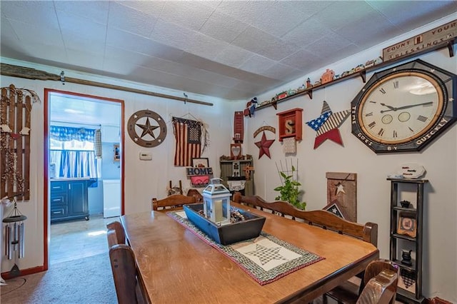 dining area featuring light tile floors