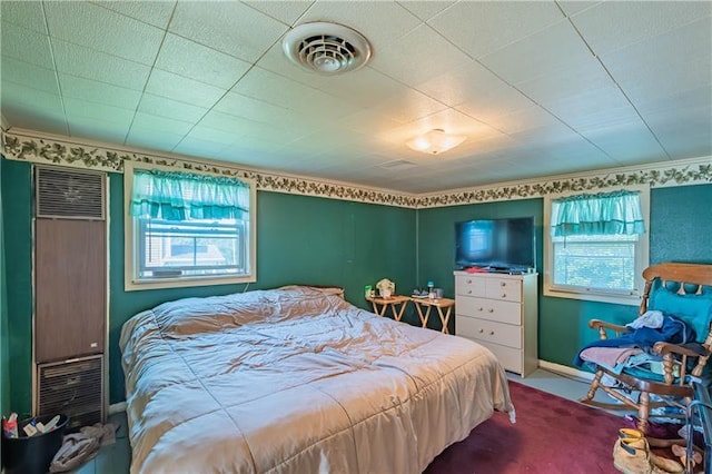 bedroom featuring multiple windows