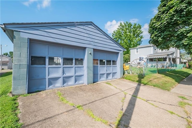 garage with a yard