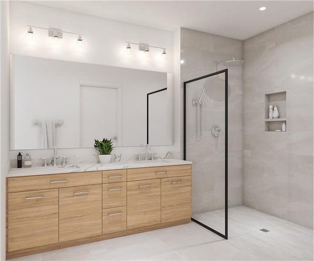 bathroom featuring oversized vanity, tile floors, dual sinks, and a shower with door