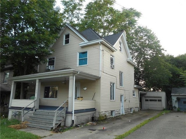 view of front facade featuring covered porch and a garage