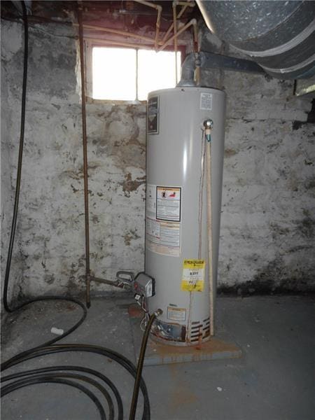 utility room featuring gas water heater