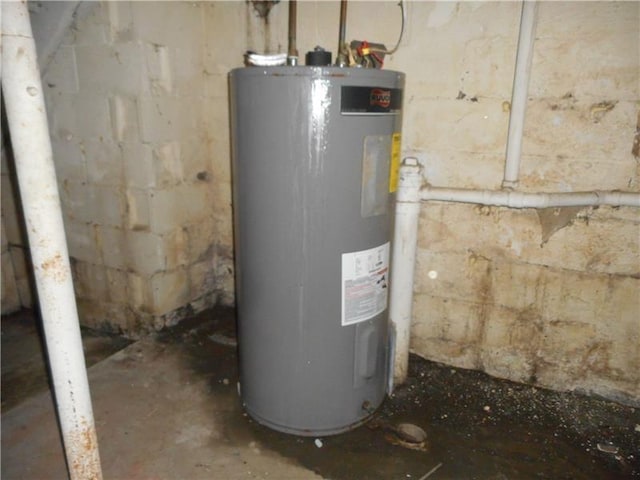 utility room featuring water heater