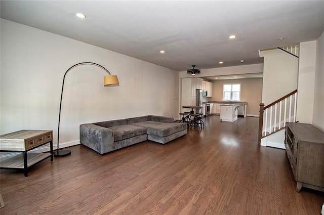 living room featuring dark wood-type flooring