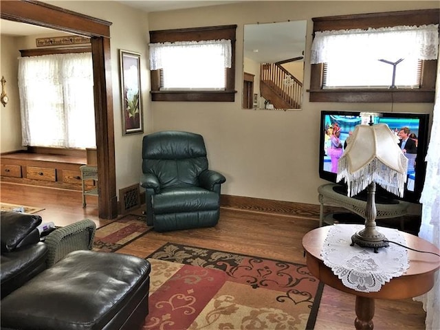 living room with plenty of natural light and wood-type flooring