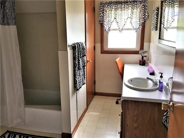 bathroom with shower / tub combo, vanity, and tile floors