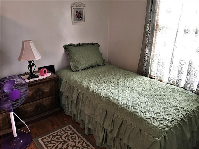 bedroom featuring dark wood-type flooring