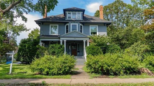 view of front of property featuring covered porch