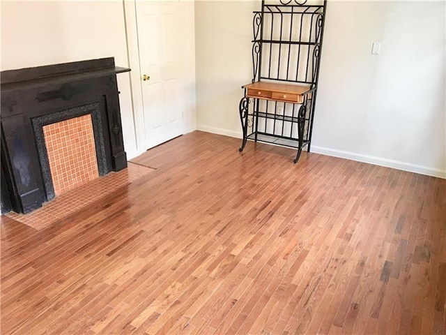 unfurnished living room featuring light hardwood / wood-style floors