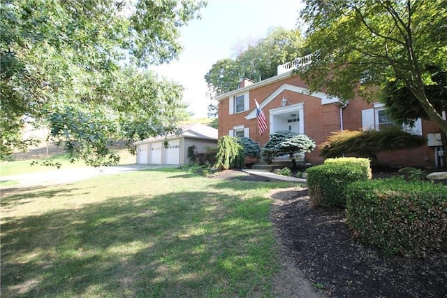 view of front facade with a front lawn and a garage