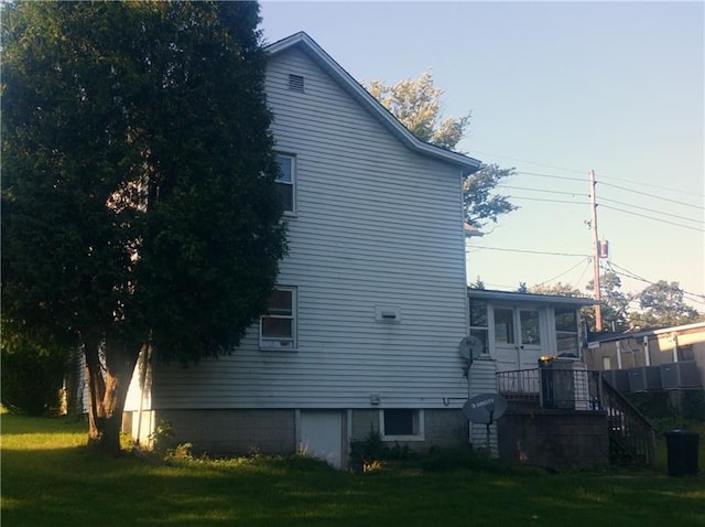 view of side of home featuring a yard