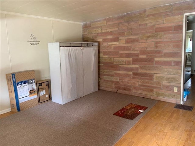 interior space with light carpet and crown molding