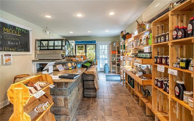 wine room with dark tile floors and french doors