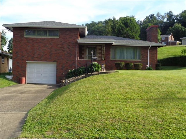 split level home featuring a front yard and a garage