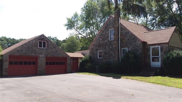 view of property exterior with a garage