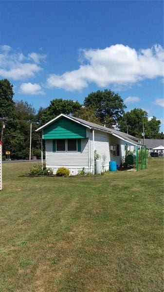 rear view of house with a lawn