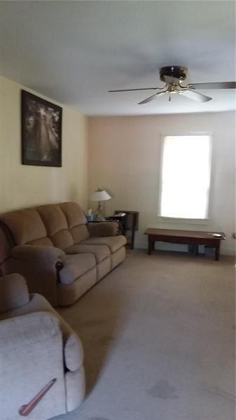 living room featuring ceiling fan and carpet floors