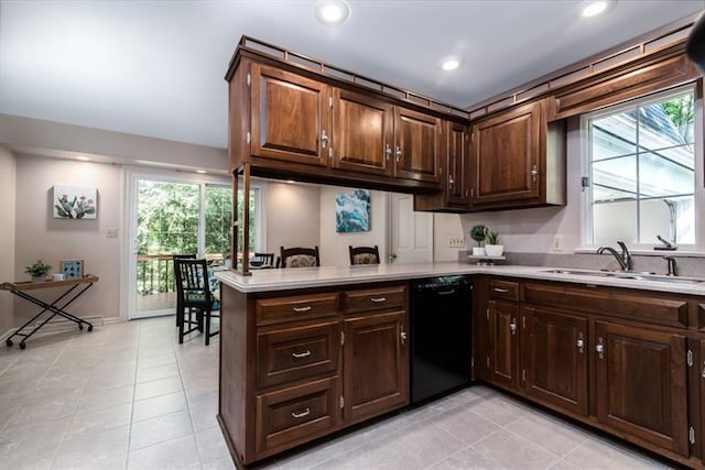 kitchen featuring dark brown cabinetry, black dishwasher, light tile floors, kitchen peninsula, and sink