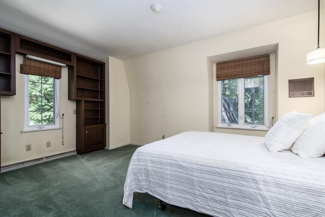 carpeted bedroom featuring a baseboard radiator