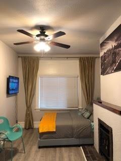 sitting room featuring ceiling fan and hardwood / wood-style floors