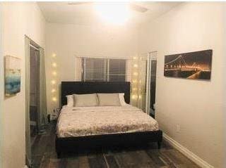 bedroom featuring dark wood-type flooring