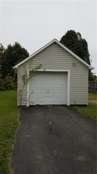 garage with a lawn