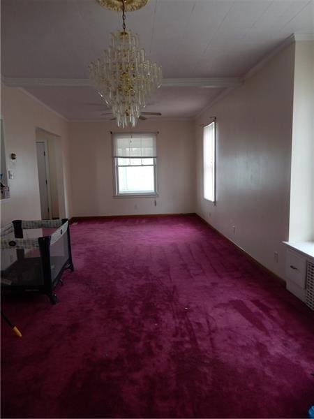 carpeted empty room with crown molding and a chandelier