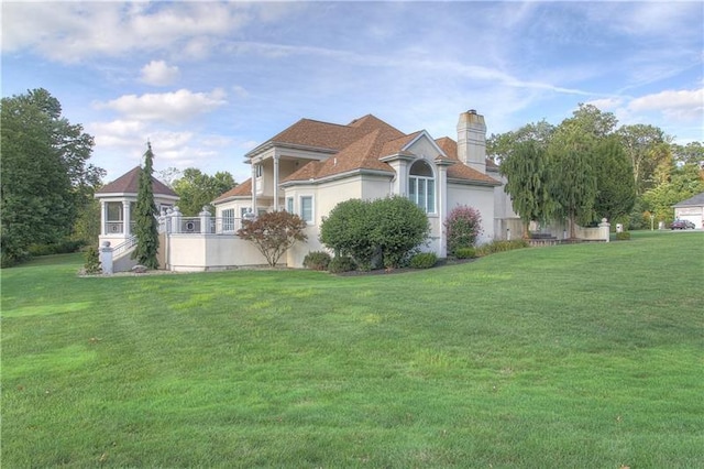 view of home's exterior with a lawn