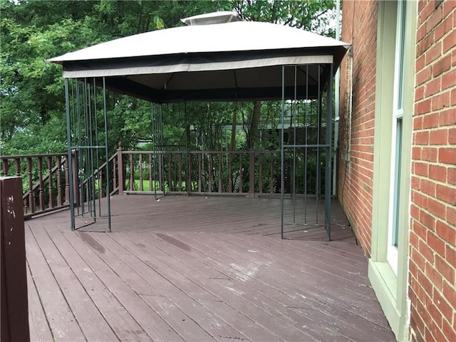 wooden deck with a gazebo