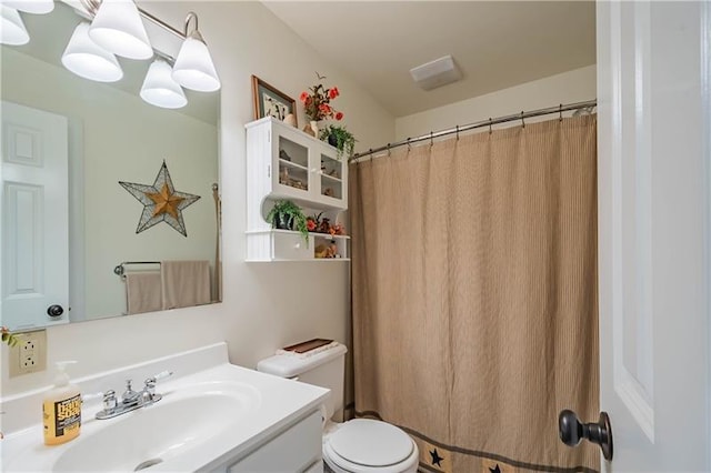 bathroom with vanity and toilet