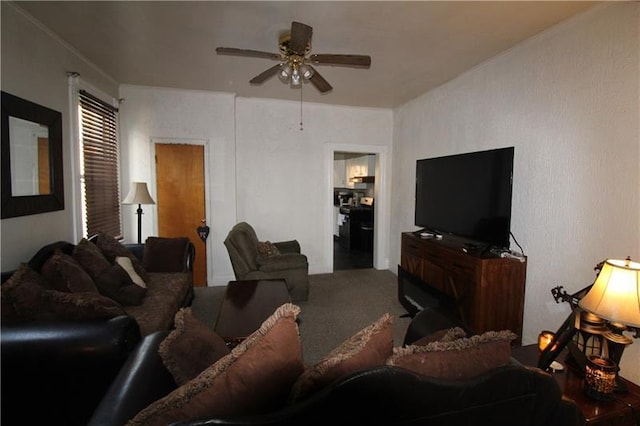 living room with ceiling fan and carpet