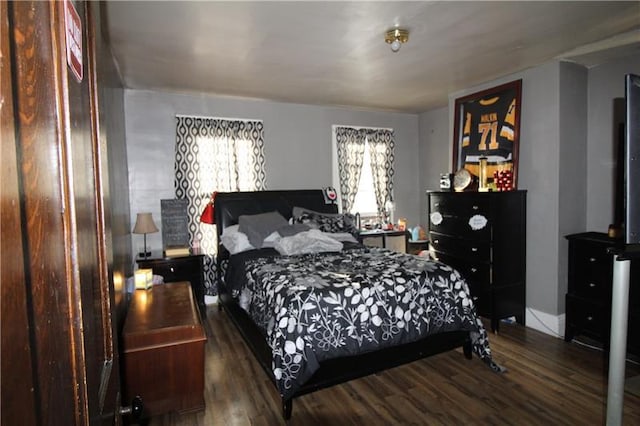 bedroom featuring dark hardwood / wood-style floors