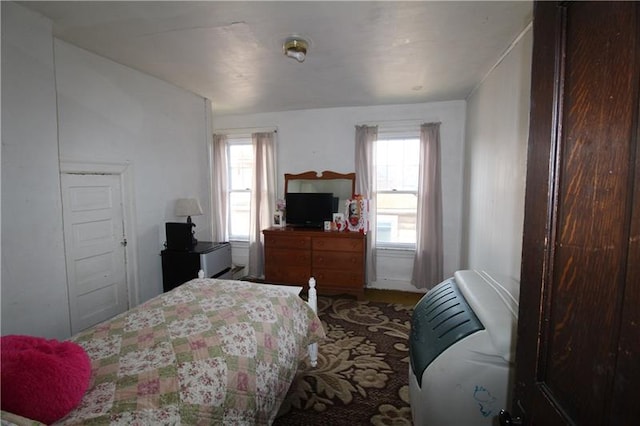 bedroom featuring multiple windows