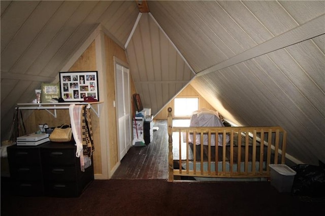 bedroom featuring dark wood-type flooring and lofted ceiling