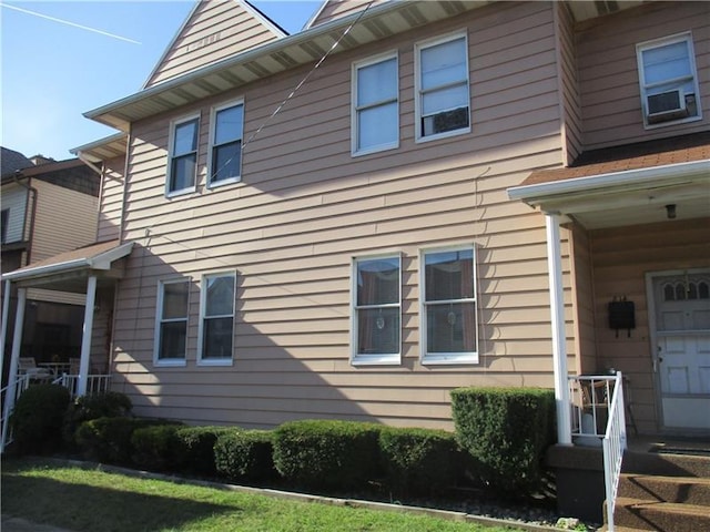 view of home's exterior with a lawn