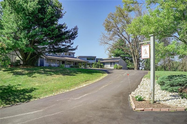 ranch-style home with a front lawn