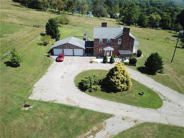 birds eye view of property with a rural view