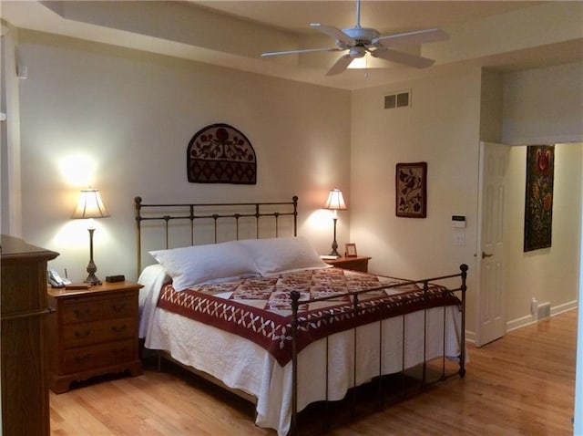 bedroom featuring ceiling fan and light hardwood / wood-style floors