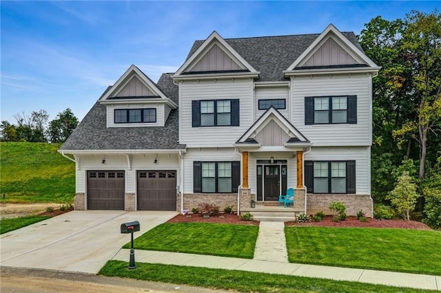 craftsman-style house featuring a front yard and a garage