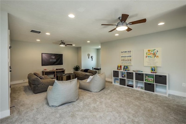 living room with light colored carpet and ceiling fan