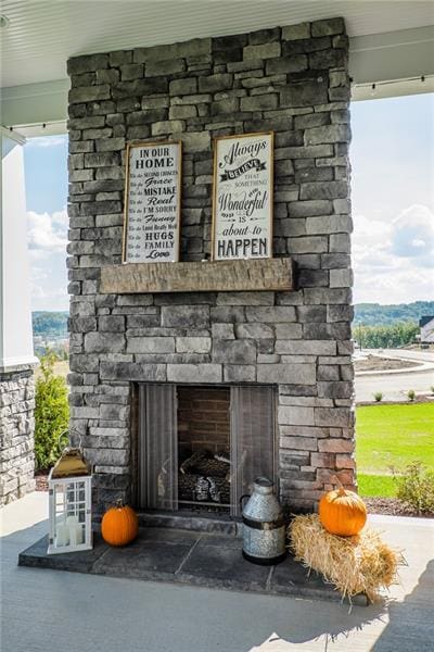 exterior details with an outdoor stone fireplace