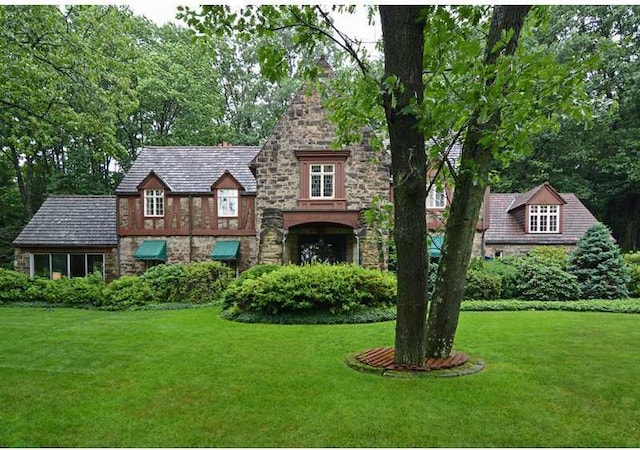 tudor house with a front lawn