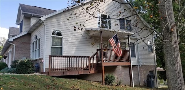 rear view of house featuring a deck