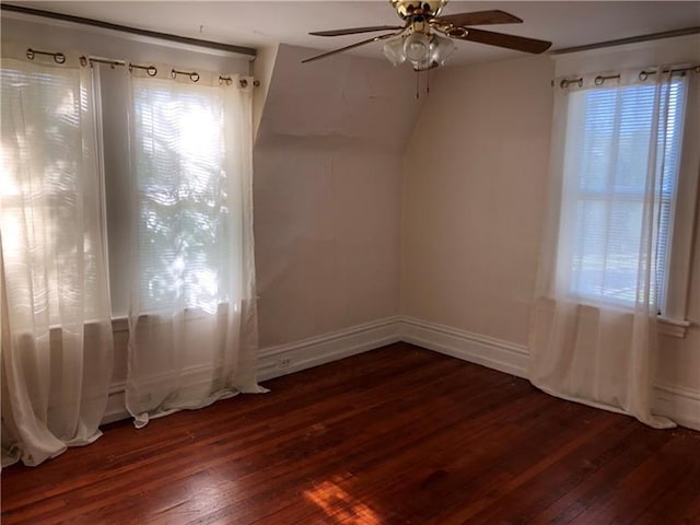 empty room featuring dark hardwood / wood-style floors and ceiling fan