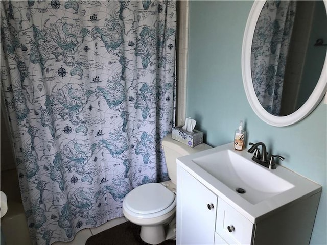 bathroom with toilet and vanity