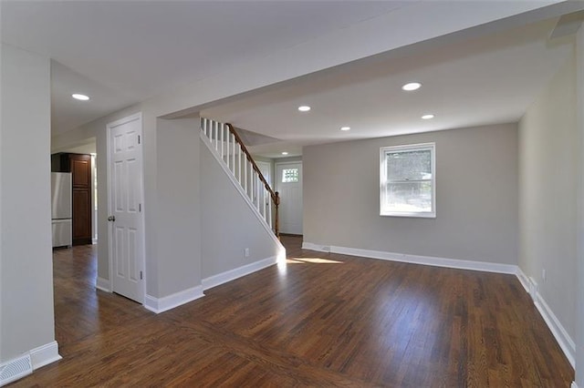 empty room with dark hardwood / wood-style floors