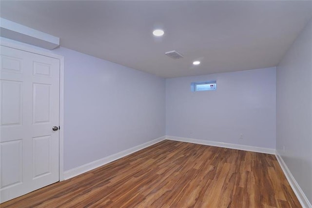 empty room featuring dark hardwood / wood-style flooring